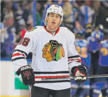  ?? | GETTY IMAGES ?? A dejected Patrick Kane leaves the ice after the Hawks’ overtime loss Saturday left them staring at a 2-0 series deficit.