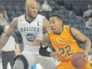  ?? THE CHRONICLE HERALD PHOTO ?? The Halifax Hurricanes’ Tyrone Williams defends against the Island Storm’s Rashad Whack during first-half action at Scotiabank Centre in Halifax, N.S., on Sunday. The Storm won the National Basketball League of Canada playoff game 119-115.