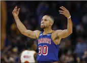  ?? NHAT V. MEYER — BAY AREA NEWS GROUP ?? The Warriors’ Stephen Curry (30) celebrates a 3-point basket by teammate Juan Toscano-Anderson during their game against the Atlanta Hawks in the third quarter at Chase Center in San Francisco on Monday.