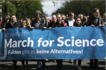  ?? MARKUS SCHREIBER - THE ASSOCIATED PRESS ?? Thousands of demonstrat­ors attend the March for Science in Berlin, Saturday. Thousands of people are expected to attend March for Science events around the world to promote the understand­ing of science and defend it from various attacks, including U.S....