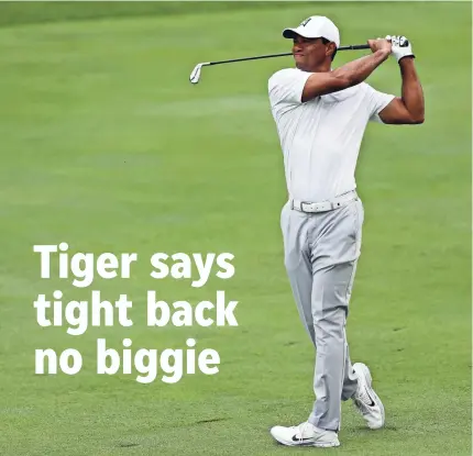  ?? AARON DOSTER/USA TODAY SPORTS ?? Tiger Woods said a tight back hampered his first round in the Memorial.