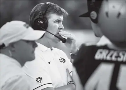  ?? Andy Cross, The Denver Post ?? Mike MacIntyre, above, the 2016 national coach of the year, has led CU to a 10-3 record, a Pac-12 division title and a berth in the Alamo Bowl. “I’m happy about every single award he gets,” says Rick George, CU’s athletic director.