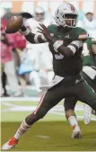  ?? AP PHOTO ?? TOSS ACROSS: Miami’s N’Kosi Perry threw for four touchdowns in a win over Florida State.