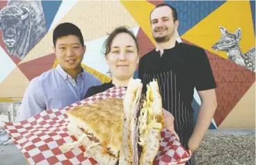  ?? David Bloom ?? Meuwly’s Artisan Market’s Glendon Tan, Brooke Babyak and Peter Keith