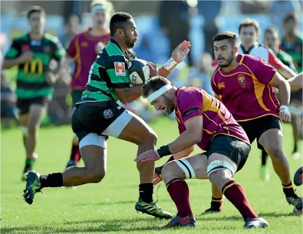  ??  ?? University’s Kieran Read braces before tackling Linwood’s Maleli Sou in a Christchur­ch club rugby derby yesterday.