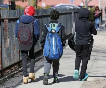  ?? hErald StaFF FilE ?? LOOKING TOWARD FALL: Students at the Mary E. Curley School in Jamaica Plain are dismissed on March 16, shortly before all schools were closed by the coronaviru­s. Experts at Johns Hopkins University says schools should be able to reopen in the fall, assuming there are low infection rates in the overall community.