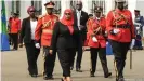  ??  ?? Samia Suluhu Hassan inpects a military honor guard after her swearing in ceremony