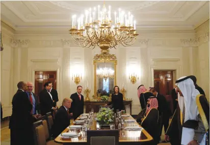  ?? (Reuters) ?? US PRESIDENT Donald Trump and Saudi Deputy Crown Prince Muhammad bin Salman take their seats for lunch in the State Dining Room of the White House on Tuesday.