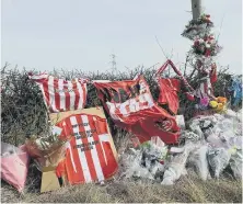  ??  ?? Tributes left for Stuart at the scene of the collision.