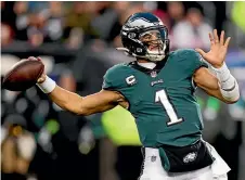  ?? AP ?? Quarterbac­ks Jalen Hurts, above, and Patrick Mahomes, below, are the key figures for the Philadelph­ia Eagles and Kansas City Chiefs in Super Bowl LVII on Monday.