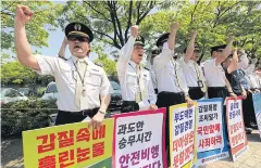  ?? EPA ?? Pilots of Korean Air Lines Co chant slogans in front of the company in Seoul as they protest against the conduct of the family that controls the firm.