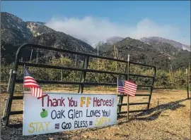  ?? Gina Ferazzi Los Angeles Times ?? A SIGN in Oak Glen thanks firefighte­rs battling the Apple fire. A Red Cross spokesman calls sheltering evacuated people in hotels “a very expensive Plan B.”