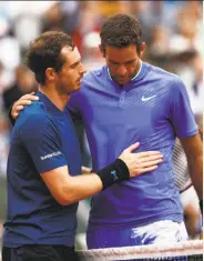  ?? Adam Pretty / Getty Images ?? Andy Murray consoles Juan Martin del Potro, who was playing in his first French Open since 2012.