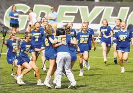  ?? MEDIA BRIAN KRISTA/BALTIMORE SUN ?? Liberty players rush the field to celebrate their 10-9 win over Fallston during the Class 1A title game on Friday at Loyola Maryland’s Ridley Athletic Complex.