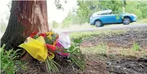  ?? PHOTO: TOM LEE/STUFF ?? Flowers placed at the scene of the car crash on Tauhei Road which claimed the life of Morrinsvil­le teacher Casey Walker.
