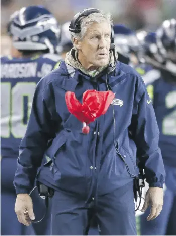  ?? OTTO GREULE JR./GETTY IMAGES ?? Seattle Seahawks coach Pete Carroll says his team is not concerned about which quarterbac­k the San Francisco 49ers will start this Sunday, but instead is focused on their style of attack.