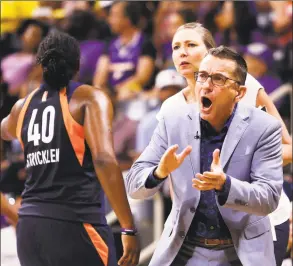  ?? Ringo H.W. Chiu / Associated Press ?? Connecticu­t Sun head coach Curt Miller, right, greets his players during a timeout in the second half of Game 3 of a WNBA playoff game against the Sparks in September.