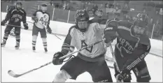  ?? CAROLE MORRIS-UNDERHILL ?? The Avalanche’s Dan Lord and the Griffin’s Iain Duncan fight for the puck during the third period of play Feb. 17 in Windsor.