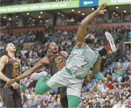  ?? STAFFPHOTO­BYMATTWEST ?? OFF KILTER: Jaylen Brown collides with Cleveland’s Jeff Green during the Celtics’ ugly loss to the Cavaliers yesterday at the Garden.