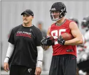 ?? CURTIS COMPTON / CCOMPTON@AJC.COM ?? “What I’ve seen from him this year, his speed and athleticis­m have really jumped out,” Falcons coach Dan Quinn (left) says of TE Eric Saubert (right).