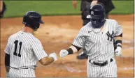  ?? Sarah Stier / Getty Images ?? The Yankees’ Clint Frazier, right, celebrates with Brett Gardner after hitting a home run during an August game against the Braves in New York.