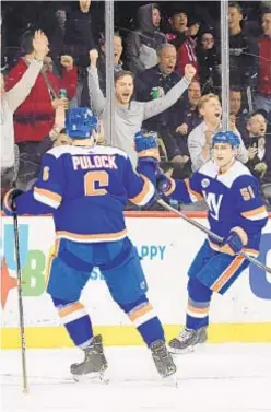  ?? GETTY ?? Ryan Pulock (l.) celebrates with Valtteri Filppula after Filppula scores in overtime to beat St. Louis Blues at Barclays Center.