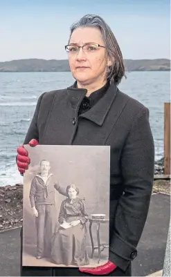  ??  ?? Anne Frater with a picture of great-grandfathe­r John Macleod, killed on the Iolaire, at the Stornoway memorial.