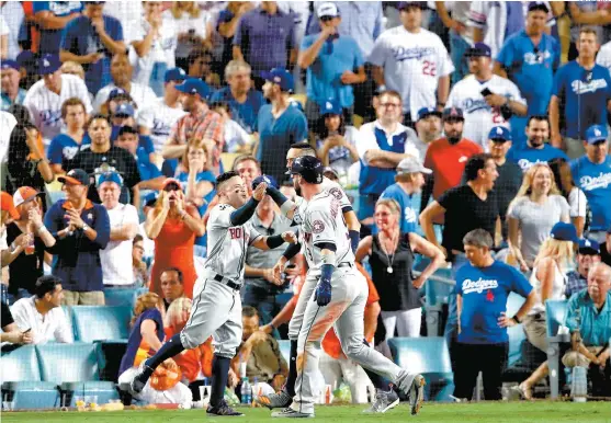  ??  ?? La celebració­n de los jugadores de los Astros de Houston