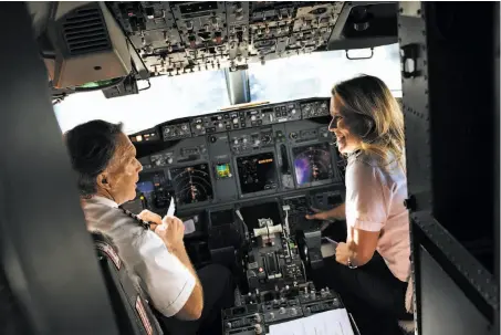  ?? Mason Trinca / Special to The Chronicle ?? Southwest Airlines Capt. Dana Lyon talks with 1st Officer Wendy Mora before a flight at Oakland Internatio­nal Airport.