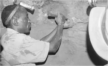  ??  ?? A Tanzanian tanzanite miner working in the Mererani mine, 300 meters into the ground, Tanzania. New laws and a crackdown on mining firms in Tanzania has slowed fresh investment in what has long been seen as one of Africa’s brightest mining prospects as...