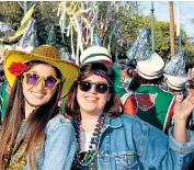  ?? ?? Drink it all in: partying on Bourbon Street during Mardi Gras in 2020
Starry-eyed: Cara, right, and Dani at the pre-pandemic Bacchus Parade