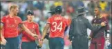  ?? GETTY ?? Umpires speak to Marlon Samuels (R) after an exchange of words with Ben Stokes during the World T20 final.