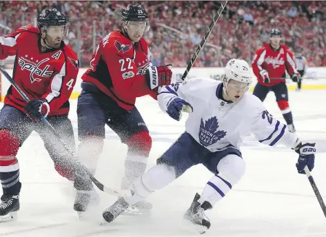  ?? PATRICK SMITH/GETTY IMAGES ?? Washington Capitals defenceman Kevin Shattenkir­k, centre, seen trying to get a grip on Toronto Maple Leafs forward William Nylander in Game 1 last week in Washington, D.C., says it’s been “great to see” his former St. Louis Blues teammates succeed in...