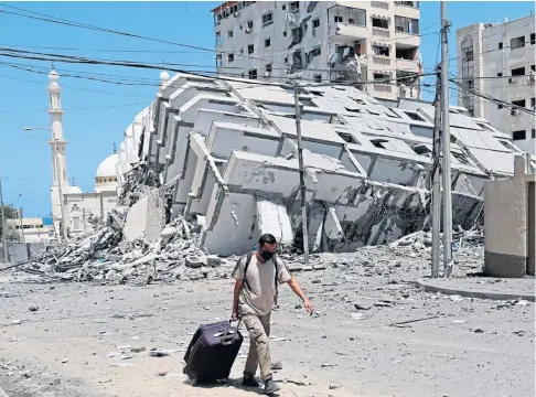  ??  ?? RUINS: Israeli air strikes have seen key Hamas targets destroyed in Gaza City, killing dozens of people.