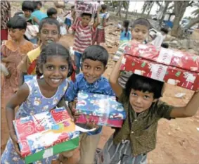  ?? PHOTO COURTESY OF OPERATION CHRISTMAS CHILD ?? Children are excited to receive their gifts from Operation Christmas Child donors.