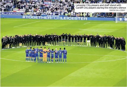  ?? SIMON GALLOWAY ?? Leicester City players and staff stand with Cardiff City players during the minute’s silence