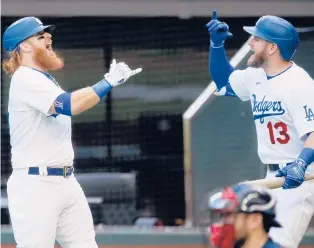  ?? APFILE PHOTO ?? The Dodgers have proved capable of finding undervalue­d young talent such as Justin Turner, left, and Max Muncy, right.