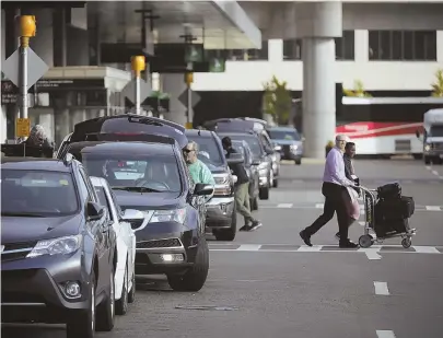  ?? STAFF FILE PHOTOS, ABOVE AND BOTTOM LEFT, BY NICOLAUS CZARNECKI; AP FILE PHOTOS, BELOW AND TOP LEFT ?? HOT APPS: A report on the use of ride-hailing apps — such as Uber's, left — in the Bay State in 2017 found that 1.8 million of the 34.9 million rides starting in the Hub left from Logan airport, above and below.