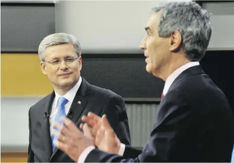  ?? Sean Kilpatrick / THE CANADIAN PRESS ?? Prime Minister Stephen Harper looks on as Liberal Leader Michael Ignatieff speaks
during the French-language federal election debate in Ottawa on April 13, 2011.