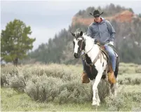 ??  ?? Interior Secretary Ryan Zinke rides a horse May 9 in the new Bears Ears National Monument near Blanding, Utah. Zinke on Monday recommende­d that the new national monument in Utah be reduced in size and said Congress should step in to designate how...