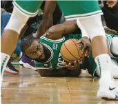  ?? WINSLOW TOWNSON/GETTY ?? The Celtics’ Jaylen Brown gathers a loose ball against the Los Angeles Clippers during the second half Thursday at TD Garden in Boston.