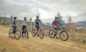  ??  ?? Mountain bikers on the trail which they will undertake maintenanc­e and repairs on next weekend.