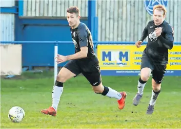  ?? ?? Eyes on the prize Jack Garrad charges down on goal to score his second (Pic: Fiona McGinty)