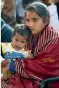  ??  ?? Mahadevi ( from left), wife of Lance Naik Hanamantha­ppa Koppad, with their daughter Netra, and defence minister Manohar Parrikar pay tribute to the soldier, who died on Thursday morning, at Brar Square. —