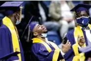  ??  ?? UTC football player and member of the class of 2021 Brandon Dowdell is seen at a graduation ceremony for the UTC class of 2021 at McKenzie Arena on Friday.
