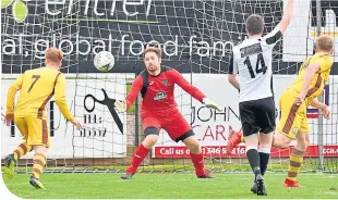  ??  ?? It’s the third goal for the Can Cans as Aaron Hamilton (No. 14) equalises