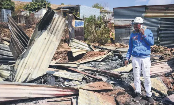  ?? Picture: Jacques Nelles ?? GUTTED. Karabo Seroka stands in the ruins of his sister Lyzah’s shack.