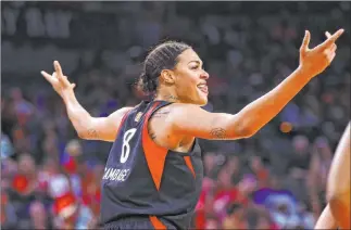  ?? Chase Stevens Las Vegas Review-journal @csstevensp­hoto ?? Aces center Liz Cambage celebrates after scoring against the Seattle Storm in the second half of a 79-62 victory Tuesday night at Mandalay Bay Events Center that improved the second-year franchise to 13-6.