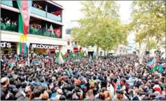  ?? AFP ?? Azerbaijan­is wave the national flag as they celebrate in the streets of the capital Baku on Tuesday.