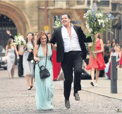  ?? Picture: PA. ?? Students from Cambridge University make their way home after celebratin­g the end of the academic year at the May Balls.